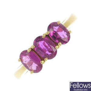 An 18ct gold ruby three-stone ring.
