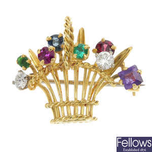 A multi-gem floral basket brooch.