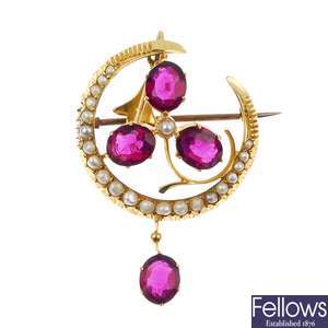 An early 20th century 9ct gold split pearl and garnet pendant. 