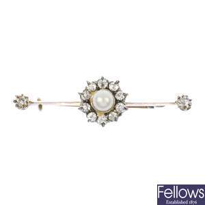 A late 19th century silver and 9ct gold cultured pearl and diamond cluster bar brooch.