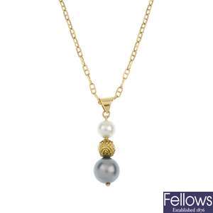 A cultured pearl pendant and a pair of cultured pearl ear pendants.