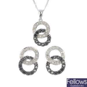 Three sets of 9ct diamond and black-gem earrings and pendants.