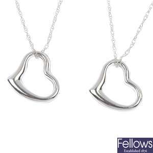 A set of twelve heart-shape pendants. 
