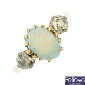 A mid 20th century platinum and 18ct gold opal and diamond three-stone ring.
