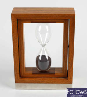 A Linley walnut and rosewood hourglass