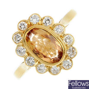 An 18ct gold topaz and diamond cluster ring.