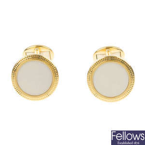 PATEK PHILIPPE - a pair of 18ct gold and porcelain 'Calatrava' cufflinks.