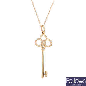 TIFFANY & CO. - an 18ct gold diamond 'Crown Key' pendant and chain.