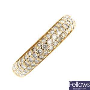 An 18ct gold diamond band ring. 