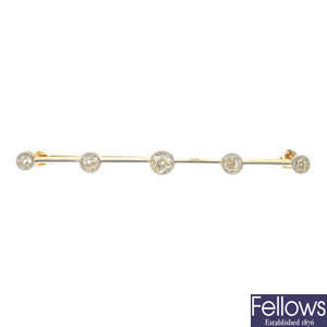 An early 20th century platinum and 18ct gold diamond bar brooch. 