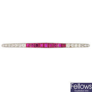 An early 20th century platinum and 15ct gold ruby and diamond bar brooch.