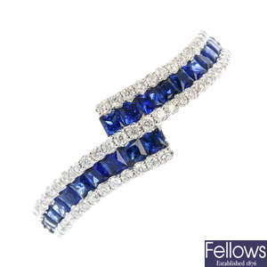 A sapphire and diamond crossover ring.