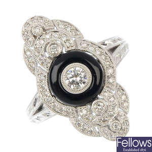 An 18ct gold onyx and diamond dress ring.