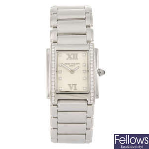 PATEK PHILIPPE - a lady's diamond set wrist watch.