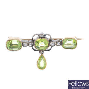 A late 19th century silver and gold peridot and diamond brooch.
