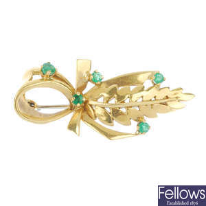 An 18ct gold emerald brooch.