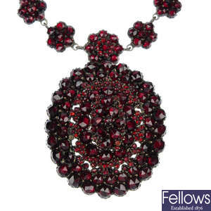 A late 19th century silver garnet and paste necklace.