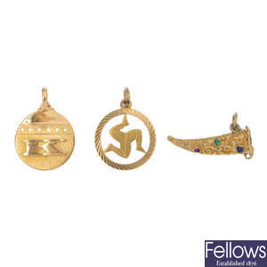 A selection of six charms. 