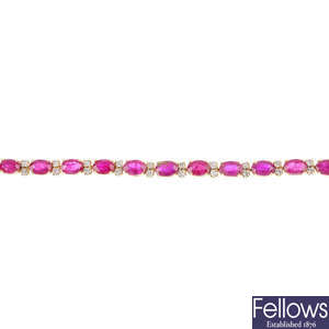 A glass-filled ruby and diamond line bracelet.