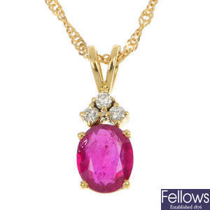 A glass-filled ruby and diamond pendant.