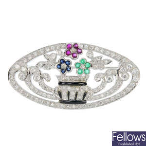 A diamond and gem-set floral brooch. 