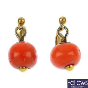 A pair of early 20th century 9ct gold coral ear pendants.