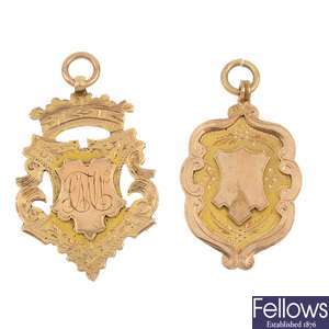 A selection of four early 20th century 9ct gold medallions.