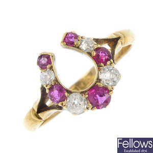 An early 20th century 18ct gold ruby and diamond horseshoe ring.