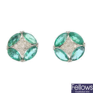 A pair of emerald and diamond ear studs.