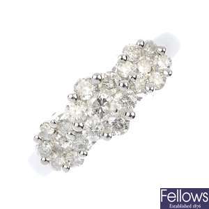 A 9ct gold diamond triple cluster ring.