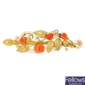 A late 19th century gold coral floral brooch.