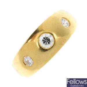 An 18ct gold diamond band ring.