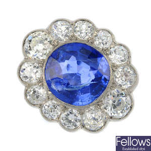 An Edwardian platinum Sri Lankan sapphire and diamond cluster ring.