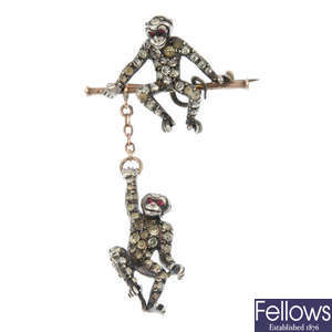 An early 20th century silver and gold paste monkey brooch.