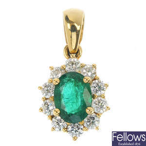 An 18ct gold emerald and diamond pendant.