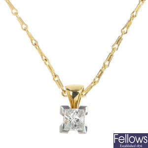 A platinum and 18ct gold diamond single-stone pendant.