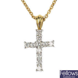 An 18ct gold diamond cross pendant. 