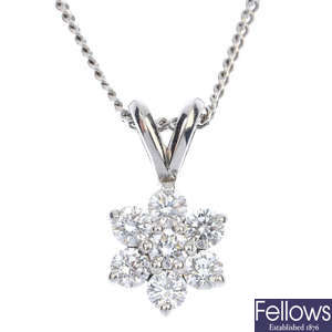 An 18ct gold diamond cluster pendant and chain. 