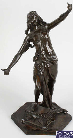 An Art Nouveau bronzed spelter figure of a maiden