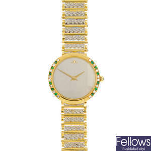JAEGER LE-COULTRE - a lady's 18ct gold diamond and emerald accent wristwatch.