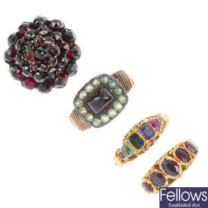 A selection of two early 19th century and two early 20th century gold gem-set rings. 