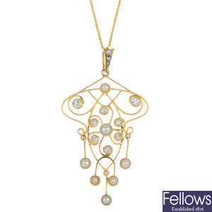 An early 20th century 15ct gold diamond and split pearl pendant.