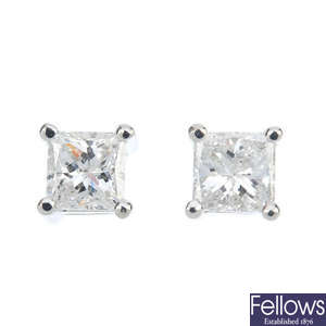 A pair of 18ct gold square-shape diamond single-stone ear studs.