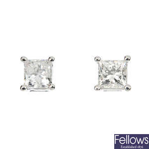 A pair of 18ct gold square-cshape diamond single-stone ear studs.