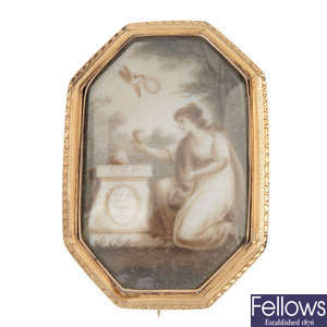 A mid 19th century gold ivory memorial brooch with ivory panel.