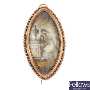 A mid 19th century gold memorial brooch with ivory panel.