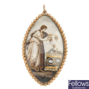 A mid 19th century gold ivory memorial pendant. 