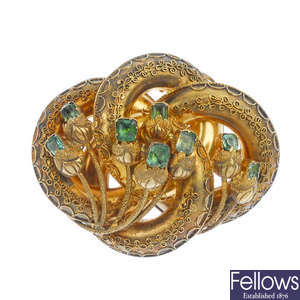 A mid 19th century gold and emerald brooch.