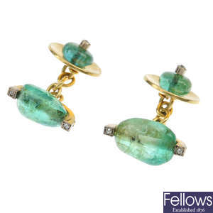 A pair of emerald and diamond cufflinks.
