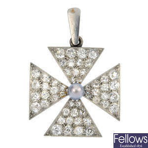 A diamond and cultured pearl cross pendant.